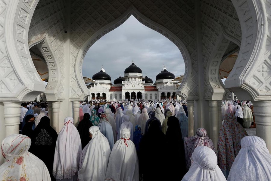 Indonesian women pray during Eid Al Fitr, the festival marking the end of Ramadan, at a mosque in Banda Aceh, Aceh Province, Indonesia.