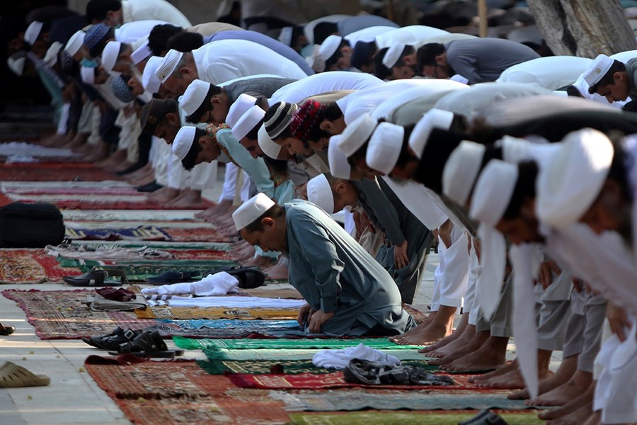 Worshippers at an open area in Peshawar, Pakistan.